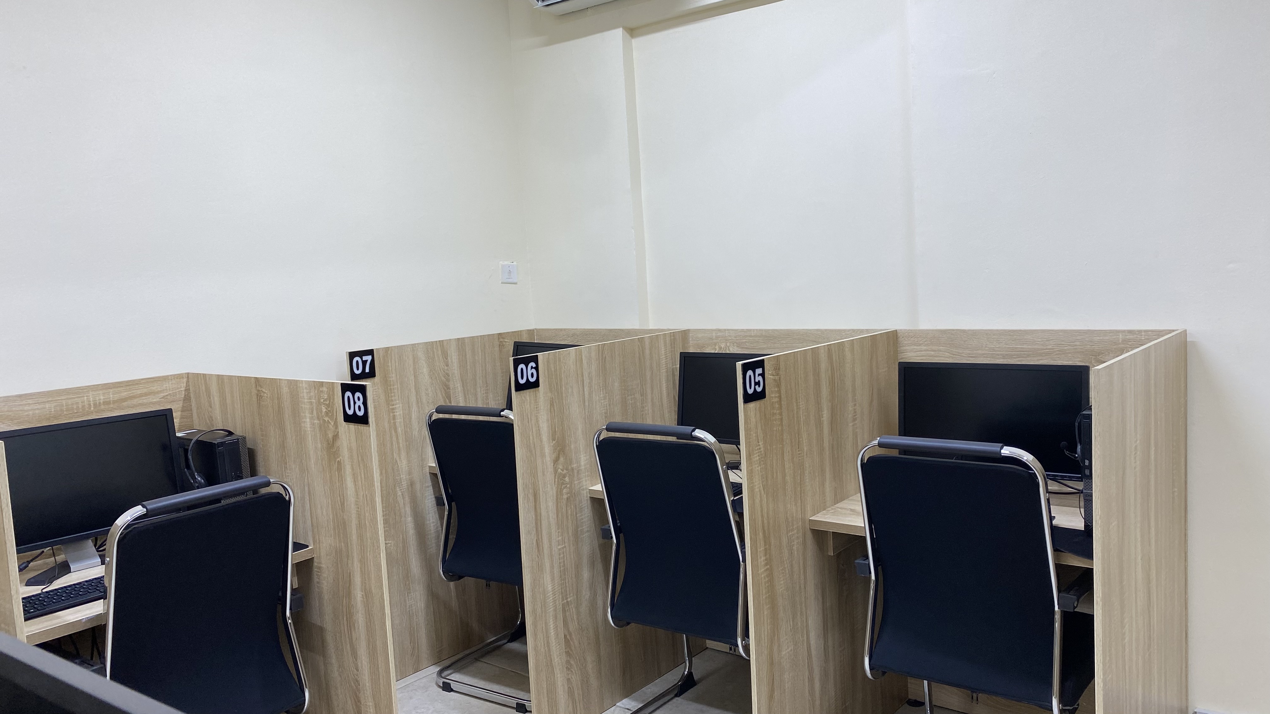 Row of numbered examination booths at Befitting Hub